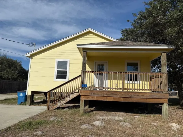 a view of a house with a roof deck
