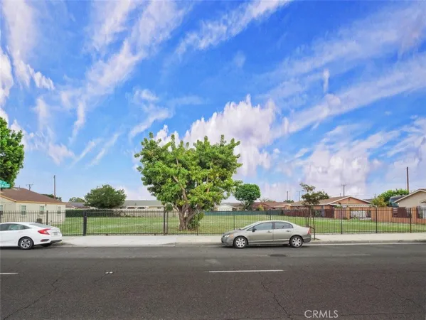 a view of street with parked cars