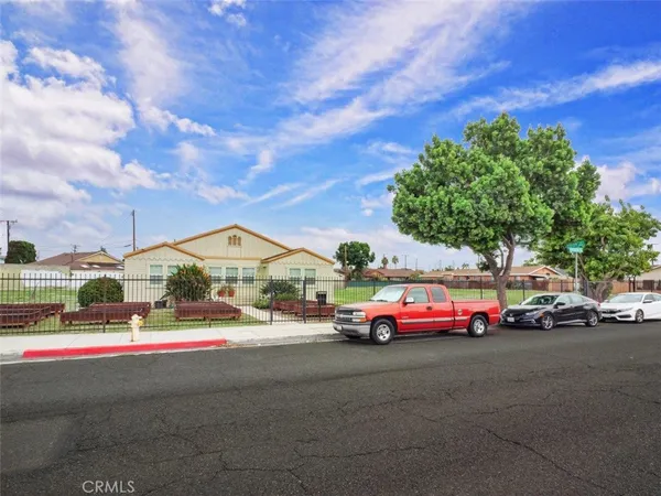a view of a house with pool and a chairs