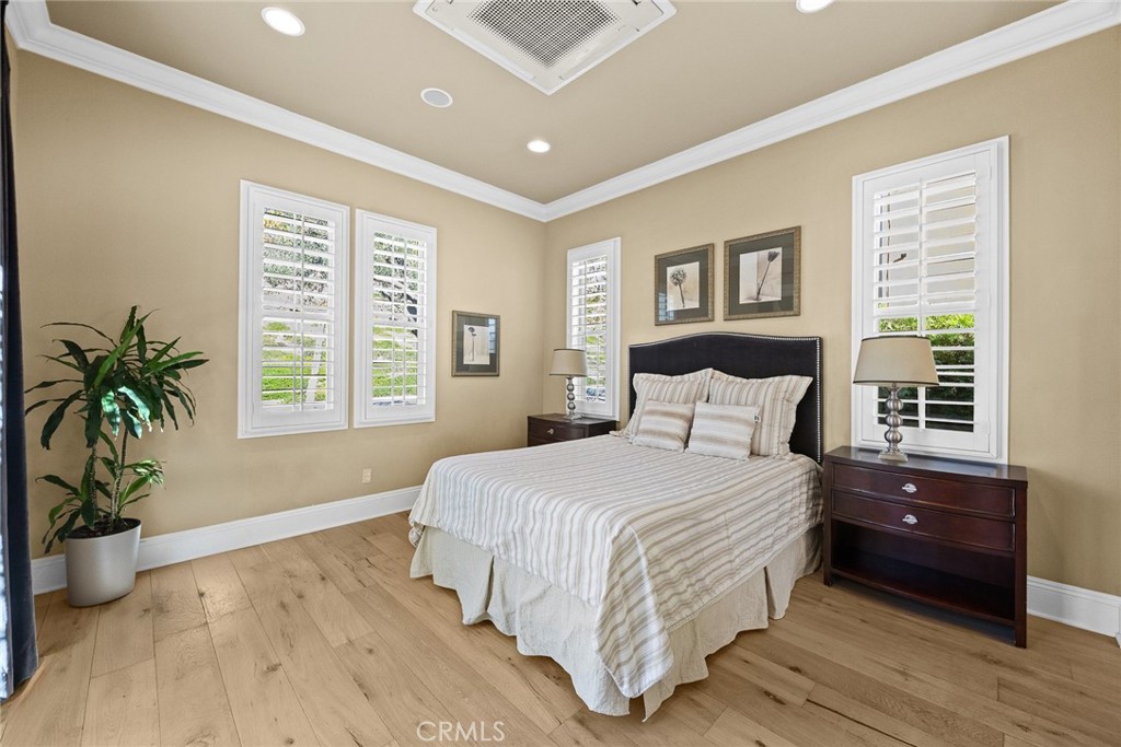 19668 Three Oaks Lane Walnut, CA 91789 - Photo 26 of 45 a spacious bedroom with a large bed and a potted plant
