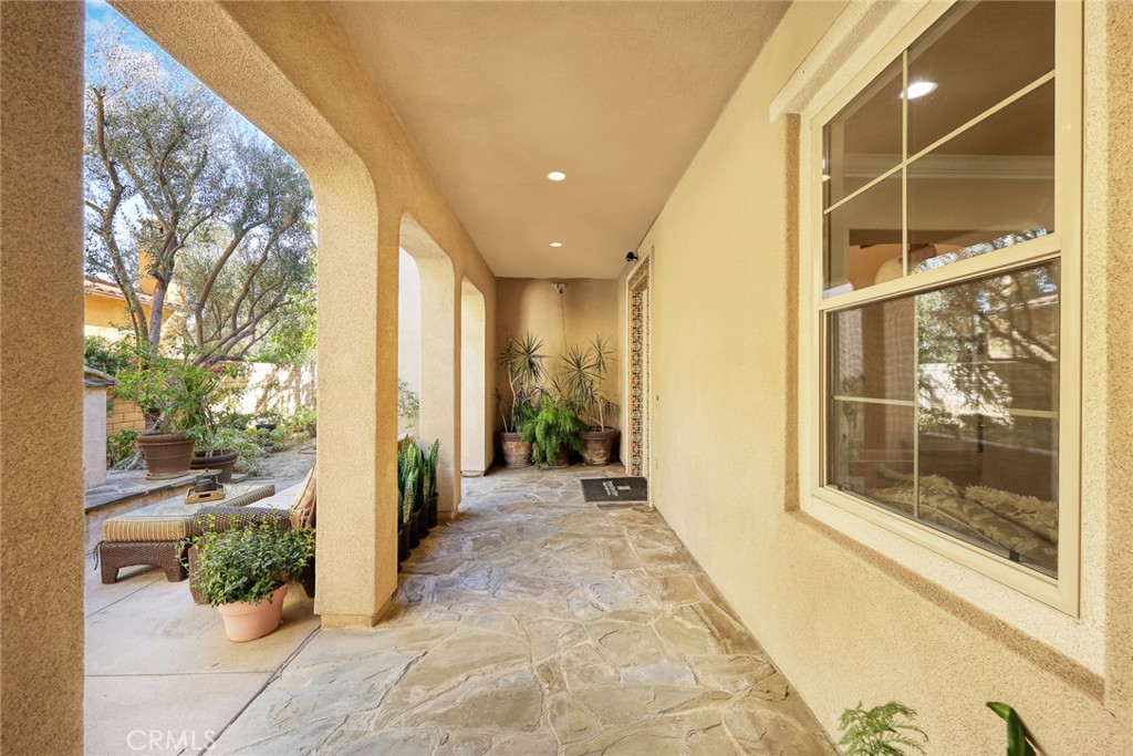 19668 Three Oaks Lane Walnut, CA 91789 - Photo 5 of 45 a view of a hallway with wooden floor and a glass door