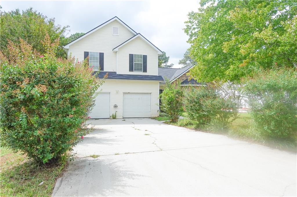 1371 Pebble Ridge Lane Hampton, GA 30228 - Photo 1 of 1 a view of a house with a yard and large tree