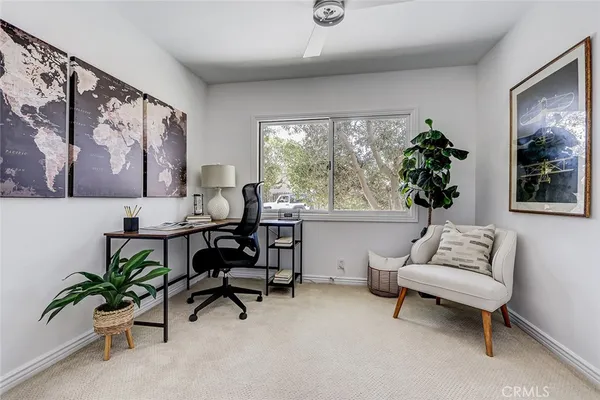 a bed room with a bed and a chair