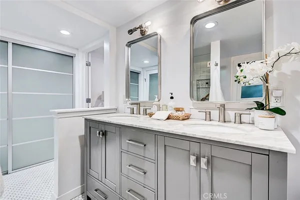 a bathroom with a sink and mirror