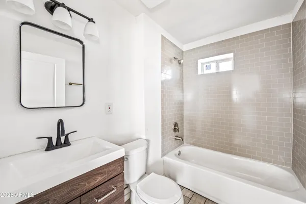 a bathroom with a toilet sink and bathtub