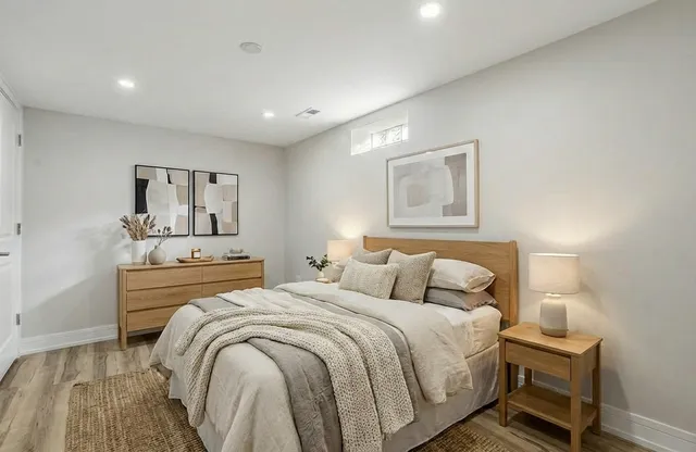 a bedroom with double bed and a night stand