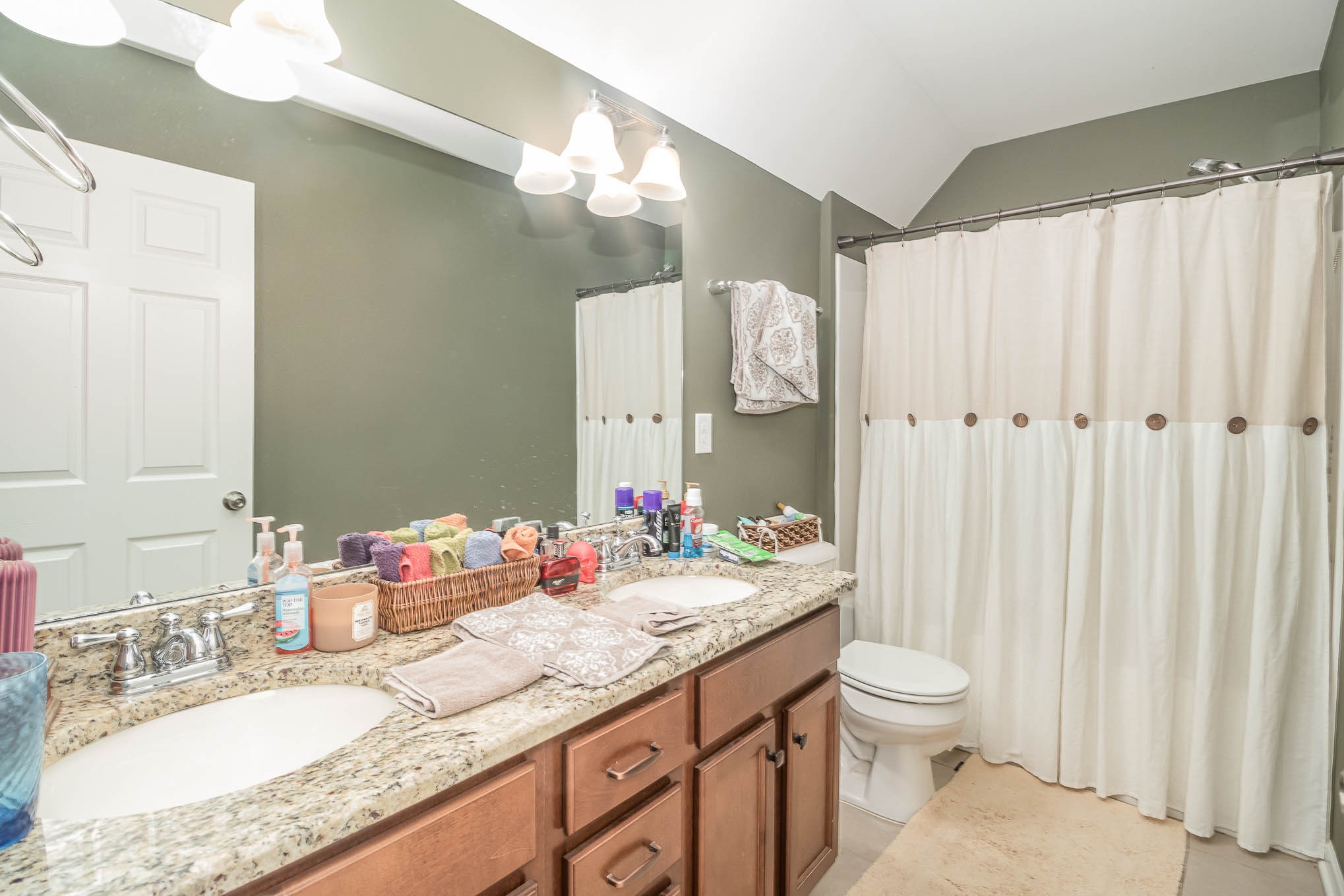 3997 Mitchell Road Lebanon, TN 37087 - Photo 14 of 27 a bathroom with a granite countertop sink a toilet and a mirror