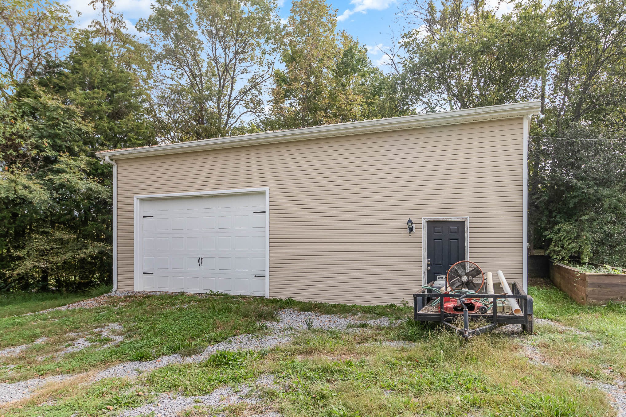 3997 Mitchell Road Lebanon, TN 37087 - Photo 24 of 27 a backyard of a house with barbeque oven and seating space