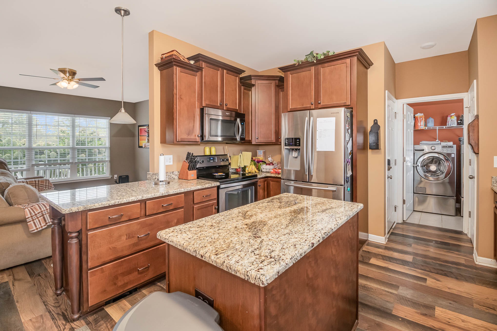 3997 Mitchell Road Lebanon, TN 37087 - Photo 6 of 27 a kitchen with stainless steel appliances granite countertop a sink stove and refrigerator