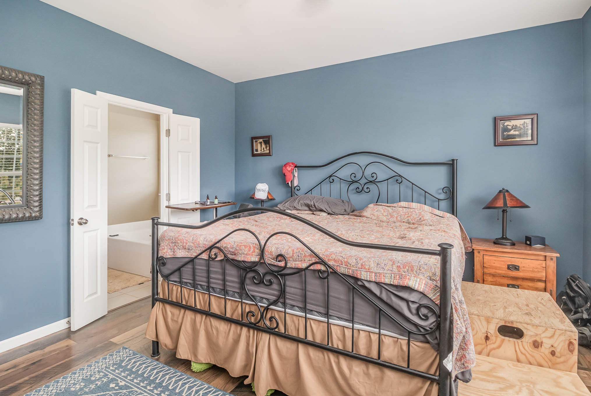 3997 Mitchell Road Lebanon, TN 37087 - Photo 9 of 27 a bedroom with a bed and a table in it