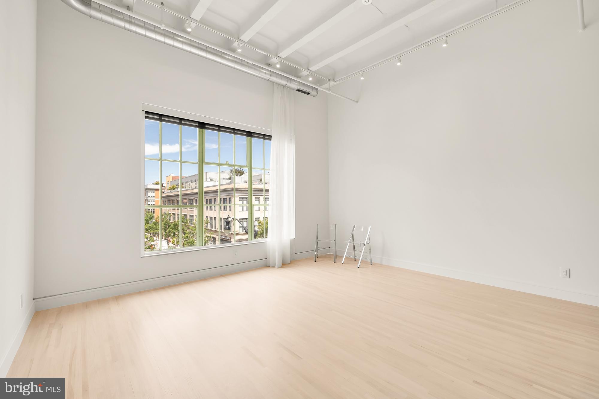 1515 14th Street Northwest, Unit 302 Washington, DC 20005 - Photo 19 of 28 a view of an empty room with a window