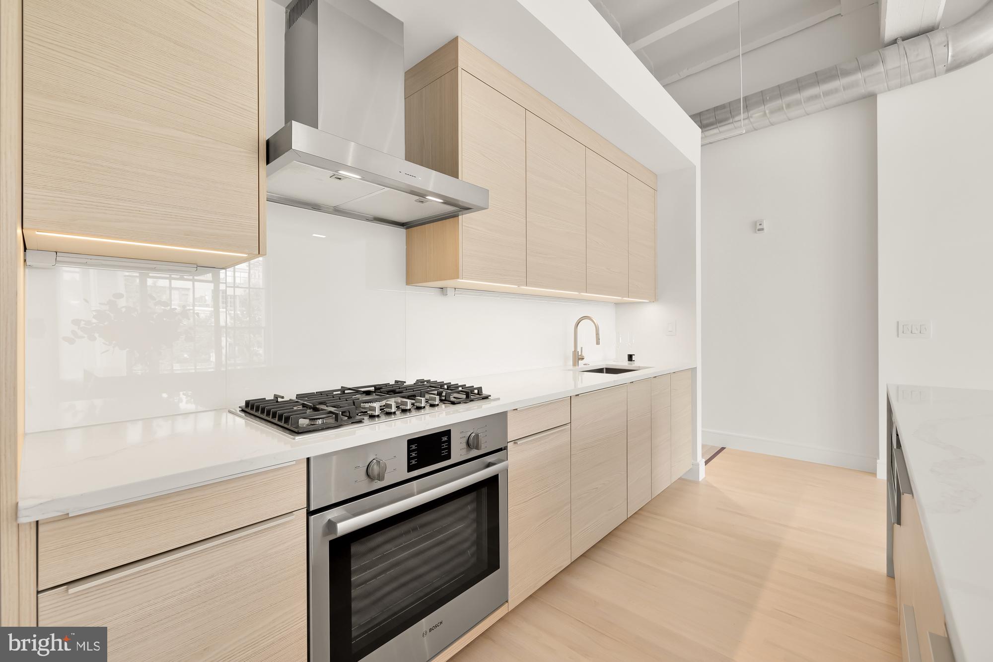 1515 14th Street Northwest, Unit 302 Washington, DC 20005 - Photo 23 of 28 a kitchen with cabinets and appliances