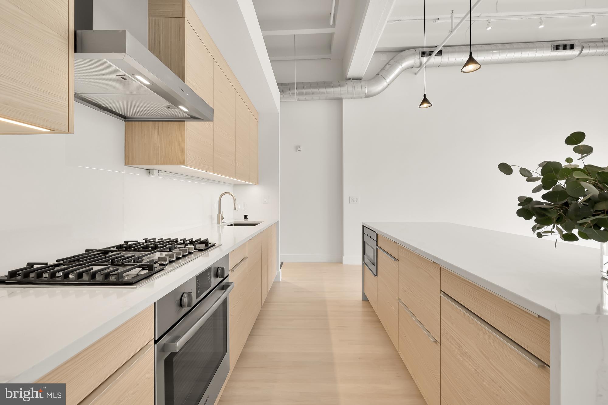 1515 14th Street Northwest, Unit 302 Washington, DC 20005 - Photo 24 of 28 a kitchen with stainless steel appliances a sink and a stove