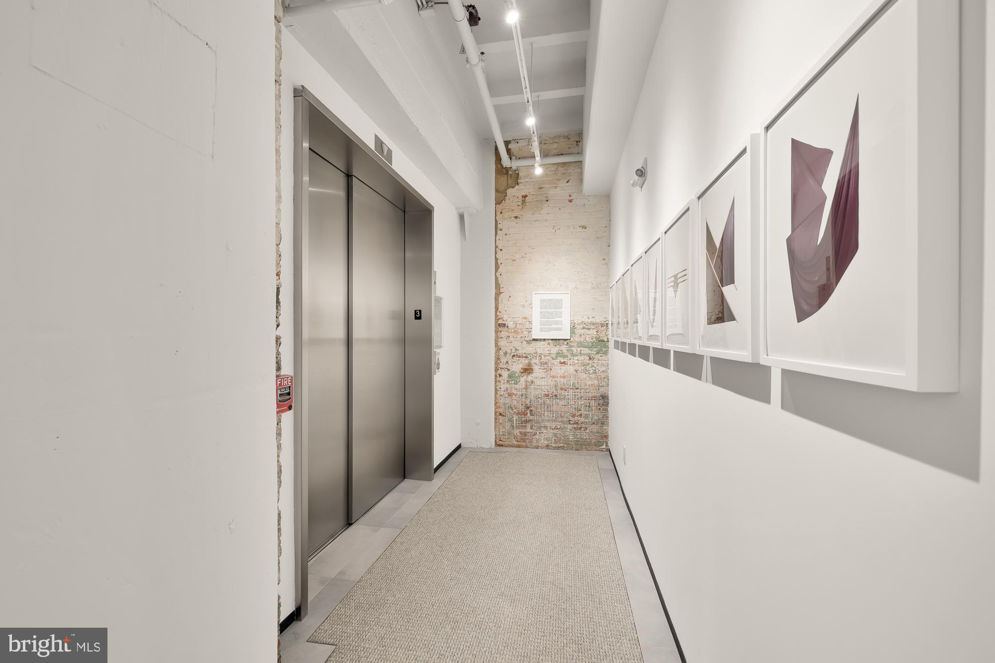 1515 14th Street Northwest, Unit 302 Washington, DC 20005 - Photo 27 of 28 a view of a hallway with stairs