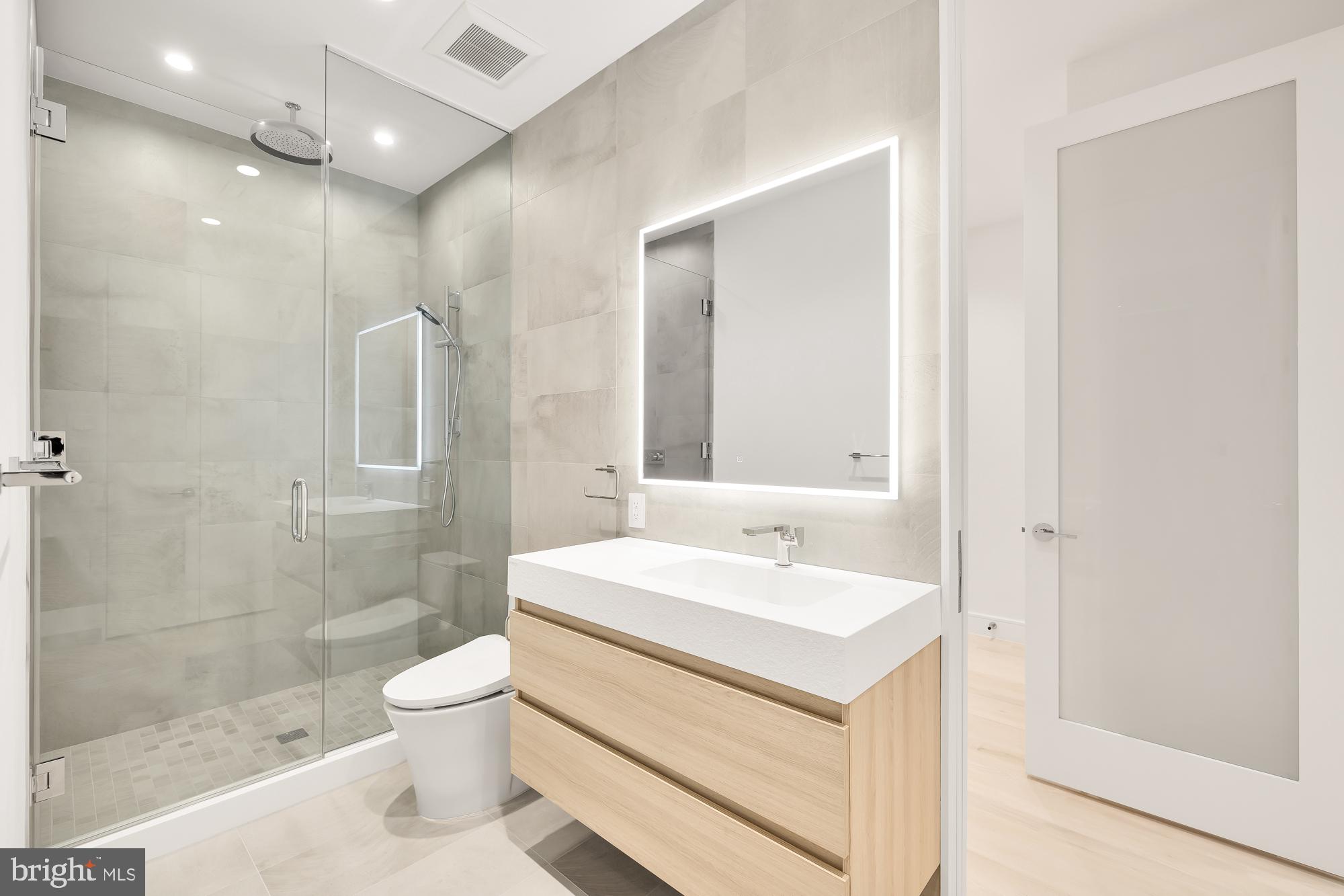 1515 14th Street Northwest, Unit 302 Washington, DC 20005 - Photo 7 of 28 a bathroom with a sink a toilet and shower