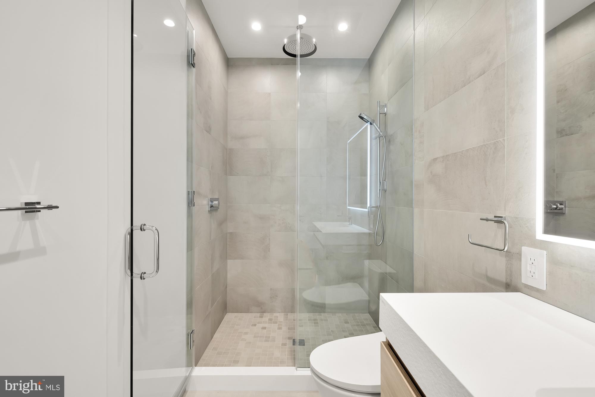 1515 14th Street Northwest, Unit 302 Washington, DC 20005 - Photo 8 of 28 a bathroom with a sink a toilet and shower