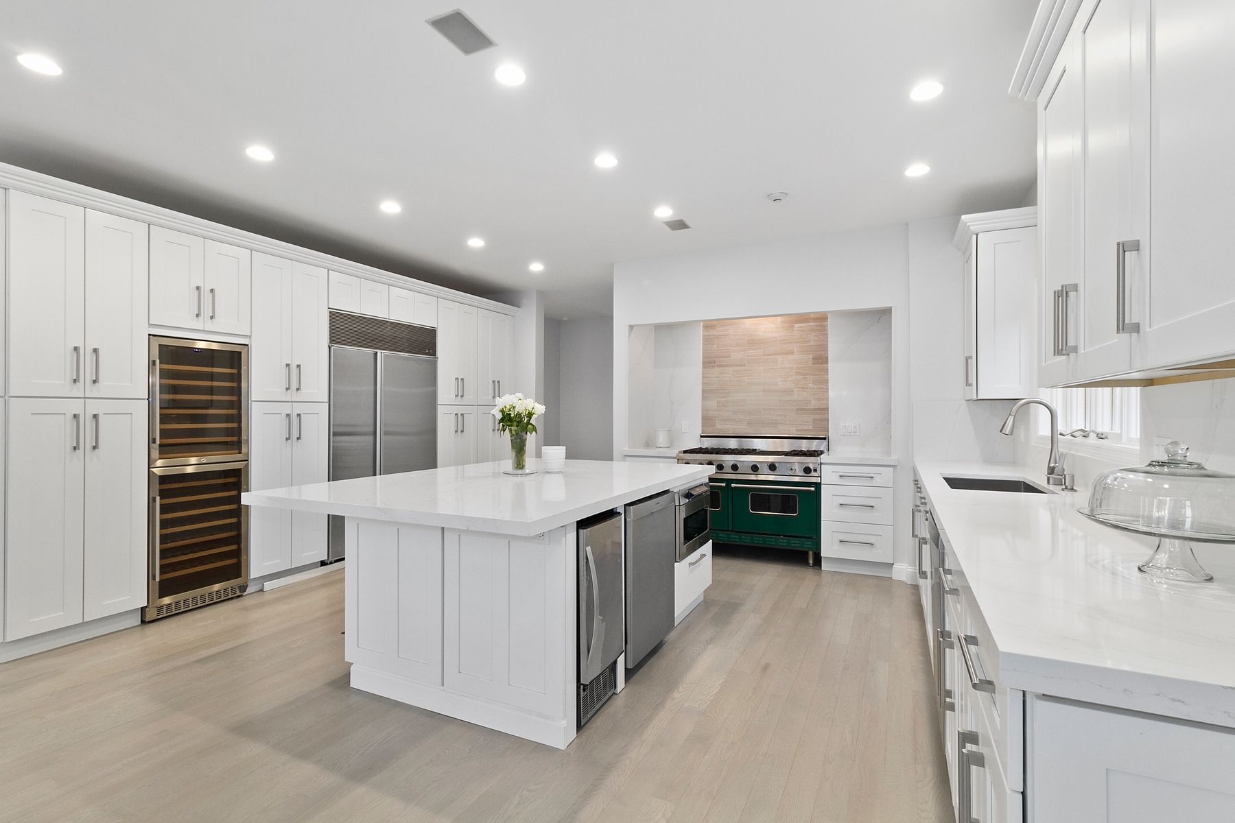 39 Pheasant Close South Southampton, NY 11968 - Photo 12 of 19 a kitchen with stainless steel appliances kitchen island granite countertop a stove and a refrigerator
