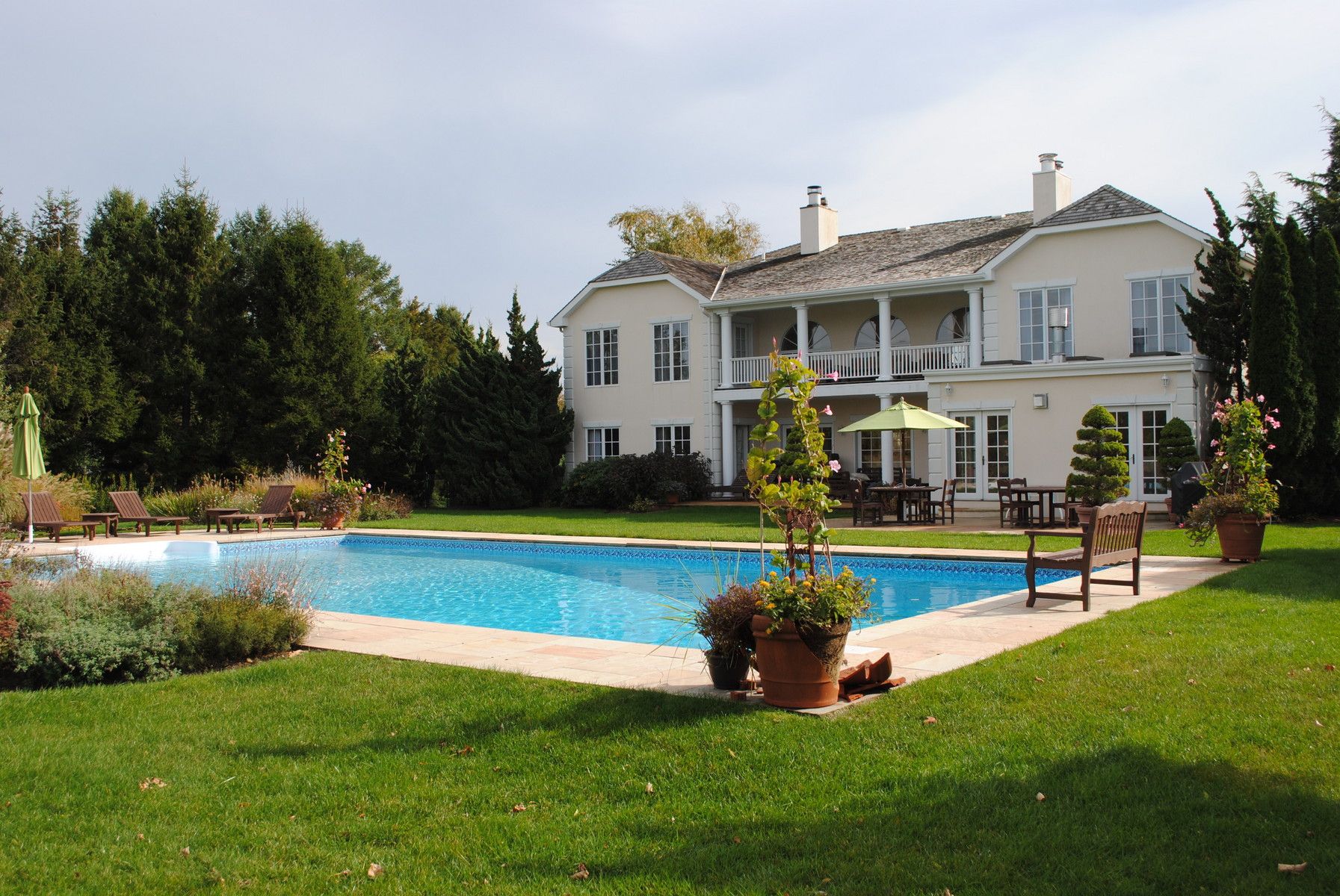 39 Pheasant Close South Southampton, NY 11968 - Photo 13 of 19 a view of house with a swimming pool and a yard