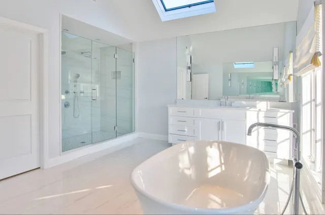 a spacious bathroom with a tub and shower