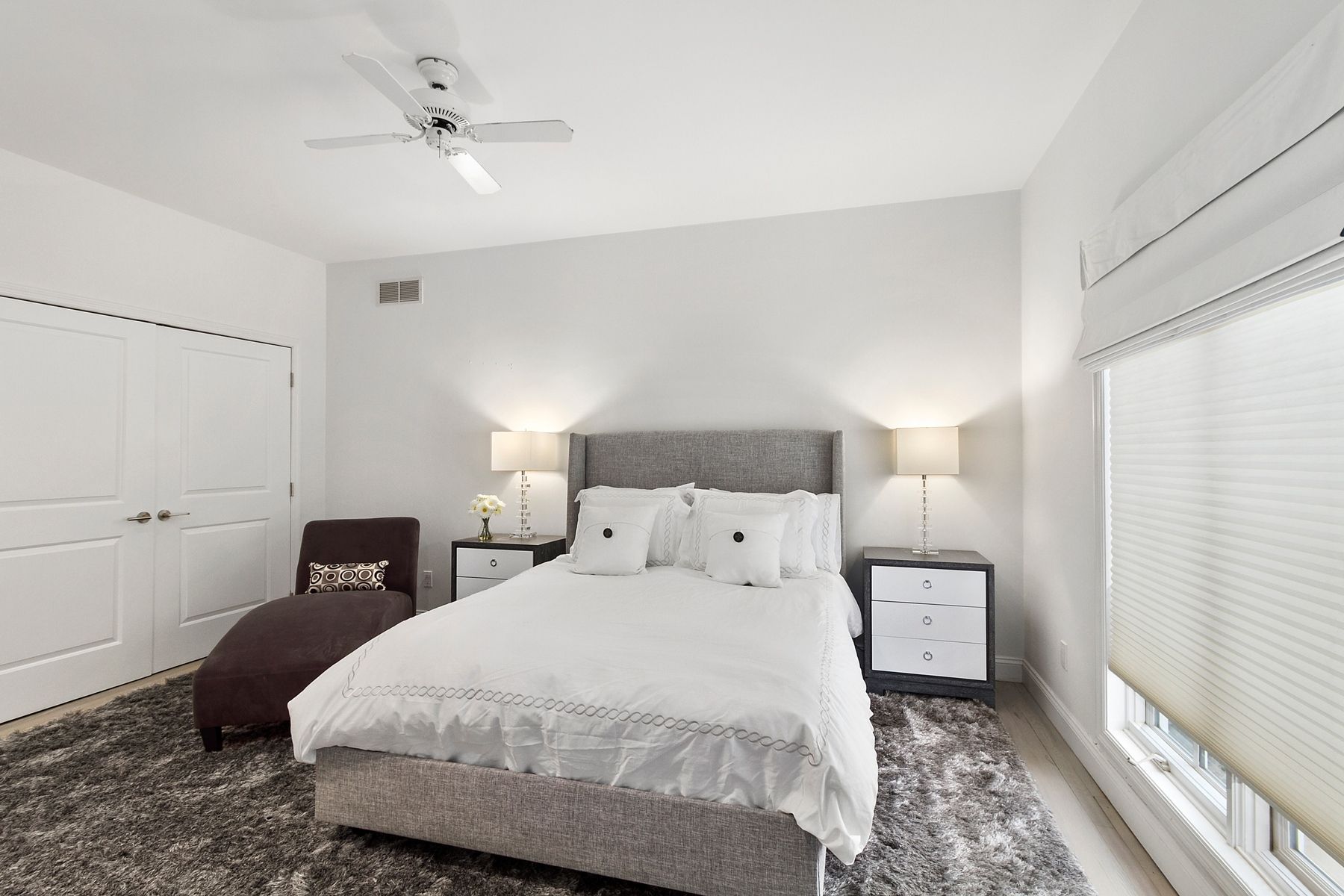 39 Pheasant Close South Southampton, NY 11968 - Photo 15 of 19 a bedroom with a bed and a chandelier