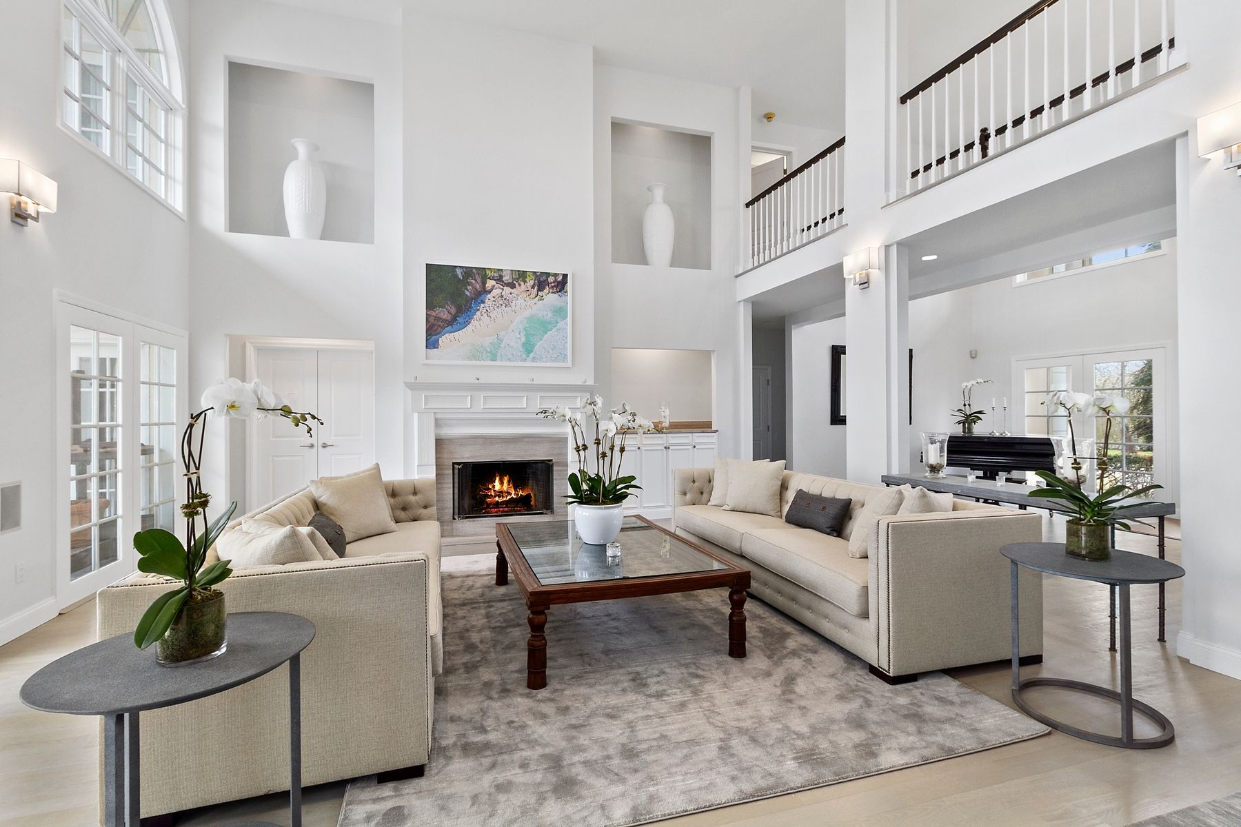 39 Pheasant Close South Southampton, NY 11968 - Photo 2 of 19 a living room with furniture a fireplace and a chandelier