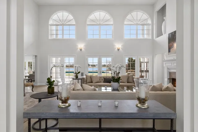 a view of a dining room with furniture and chandelier