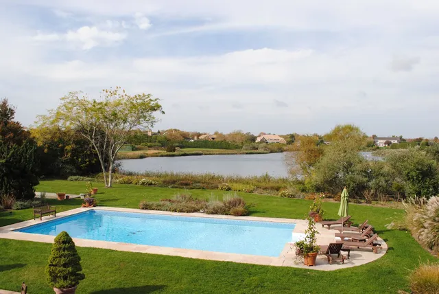 a view of a lake with a big yard