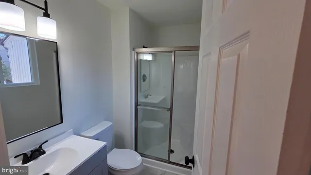 a bathroom with a sink and toilet
