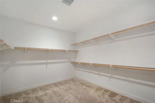 a view of an empty walk in closet