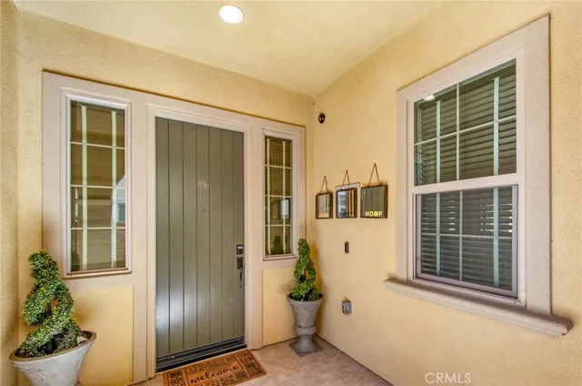 a view of porch with a refrigerator and a window
