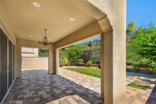a view of a porch and a back yard