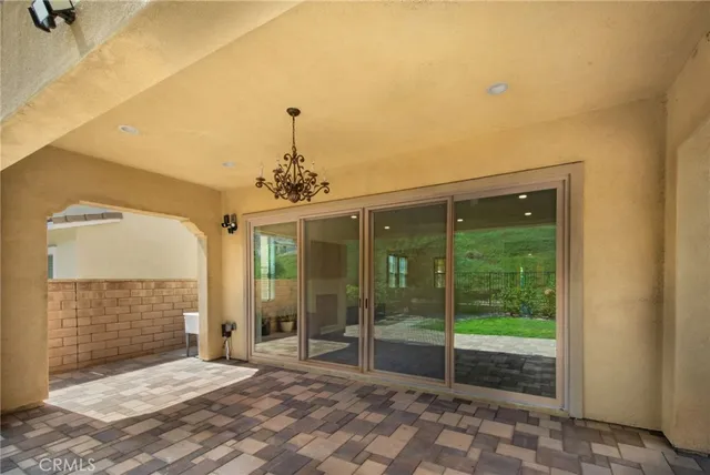 a view of a spacious bedroom with a balcony