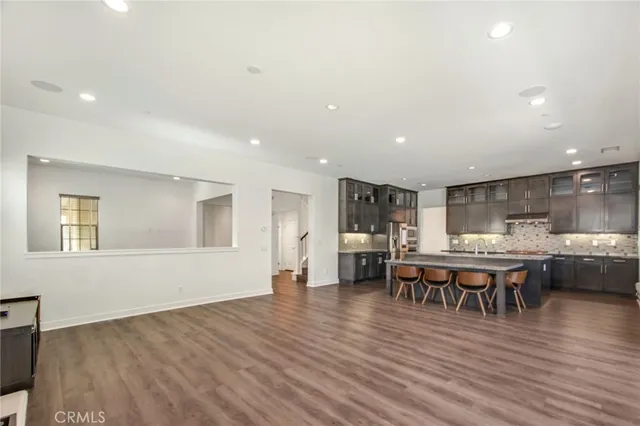 a view of a dining room with furniture wooden floor and chandelier