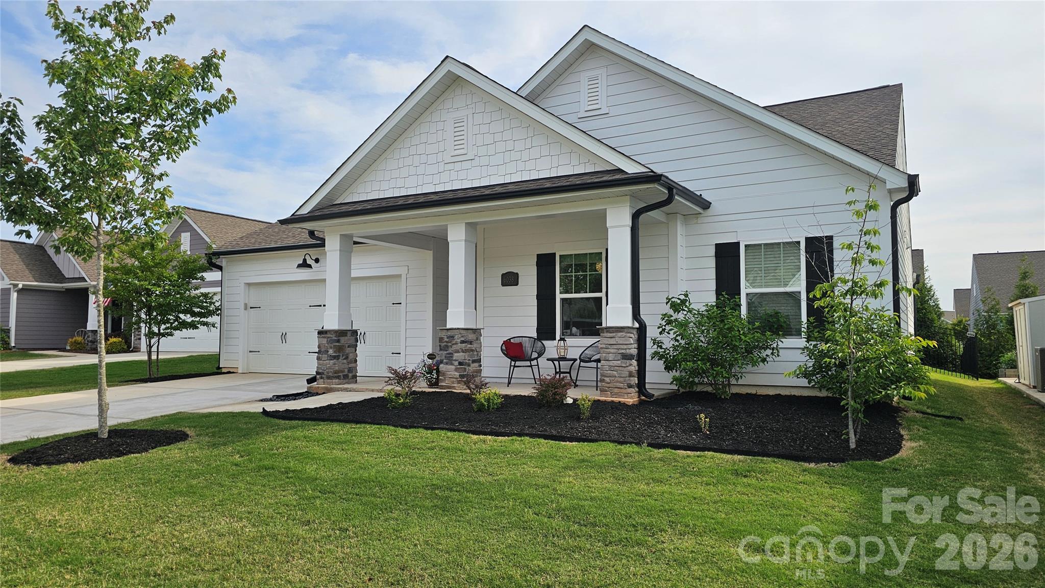 6038 Holland Street Fort Mill, SC 29707 - Photo 2 of 48 a view of a house with backyard sitting area and garden