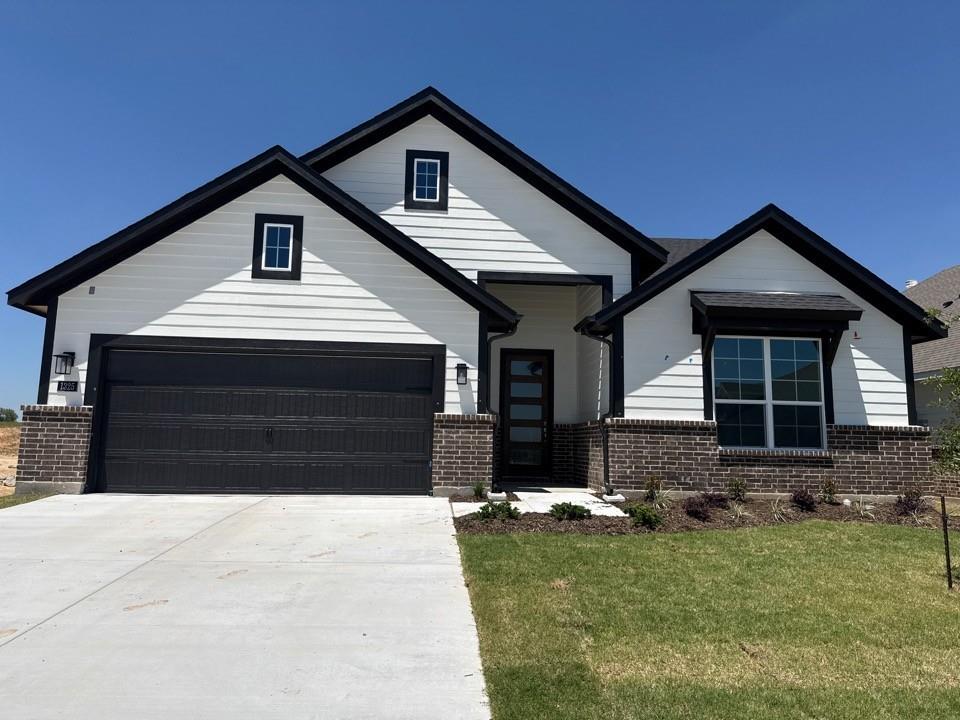 1325 Frio Drive Springtown, TX 76082 - Photo 1 of 10 a front view of a house with a yard