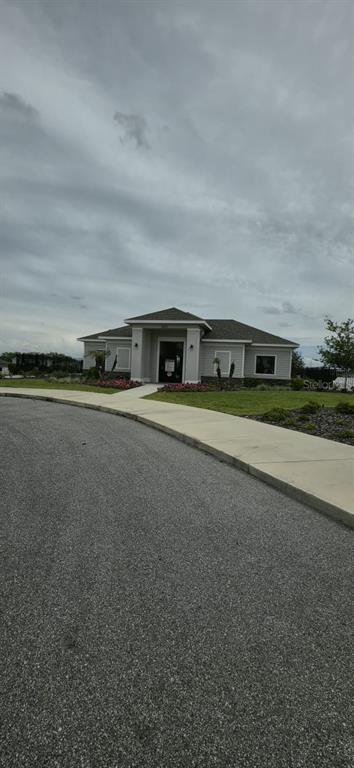 570 Feltrim Manor Road Haines City, FL 33844 - Photo 16 of 18 a view of swimming pool with outdoor seating and yard in back