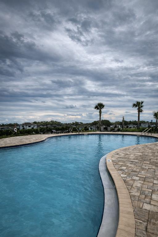570 Feltrim Manor Road Haines City, FL 33844 - Photo 17 of 18 a view of a swimming pool and an ocean view