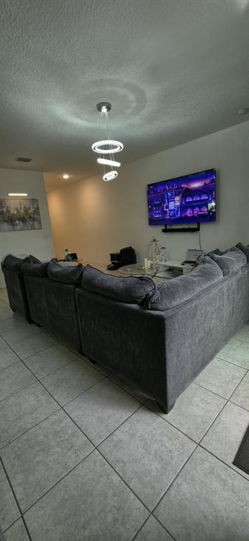 570 Feltrim Manor Road Haines City, FL 33844 - Photo 7 of 18 a living room with couch