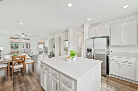 a kitchen with sink cabinets and dining table