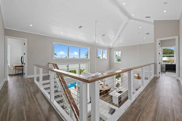 a view of an entryway with wooden floor