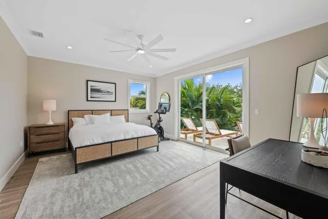 a bedroom with a bed and a desk