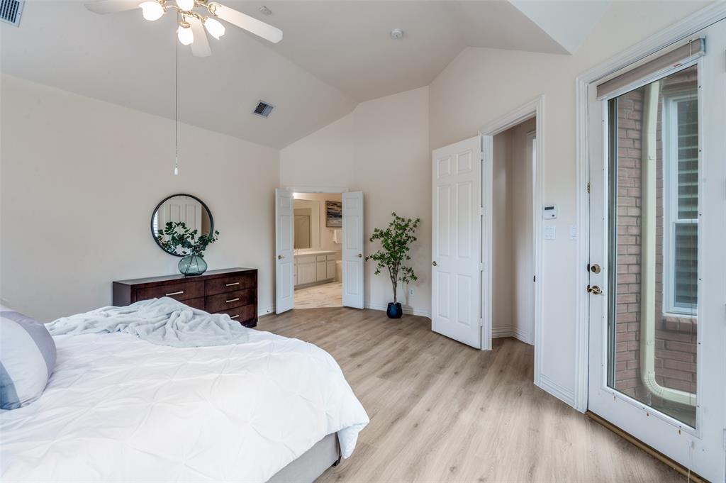 3752 Park Place Addison, TX 75001 - Photo 16 of 25 This spacious room features vaulted ceilings, light-toned flooring, and a ceiling fan