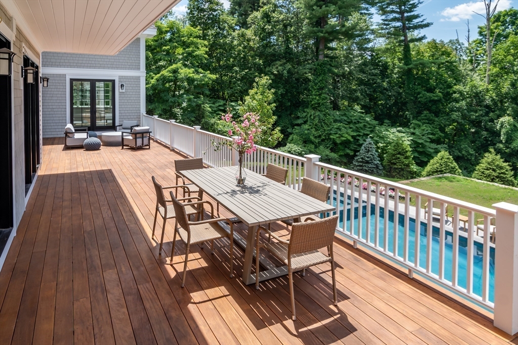 96 Love Lane Weston, MA 02493 - Photo 4 of 37 a view of balcony with wooden floor and seating space