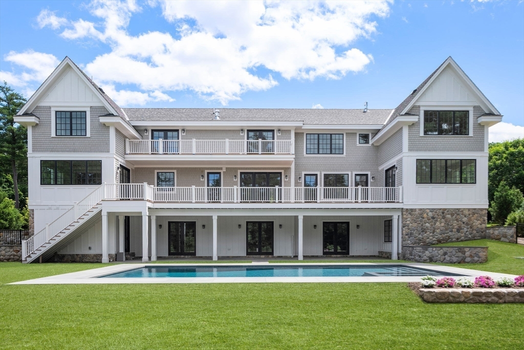 96 Love Lane Weston, MA 02493 - Photo 6 of 37 a front view of a house with a yard