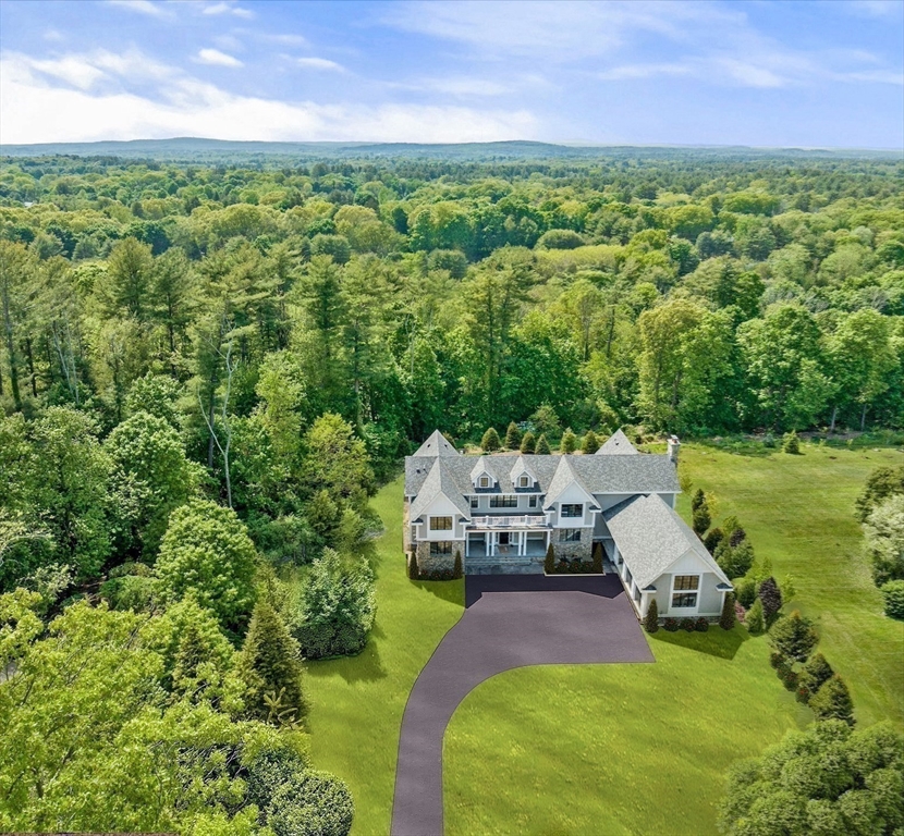 96 Love Lane Weston, MA 02493 - Photo 7 of 37 a view of a house with a yard and sitting area