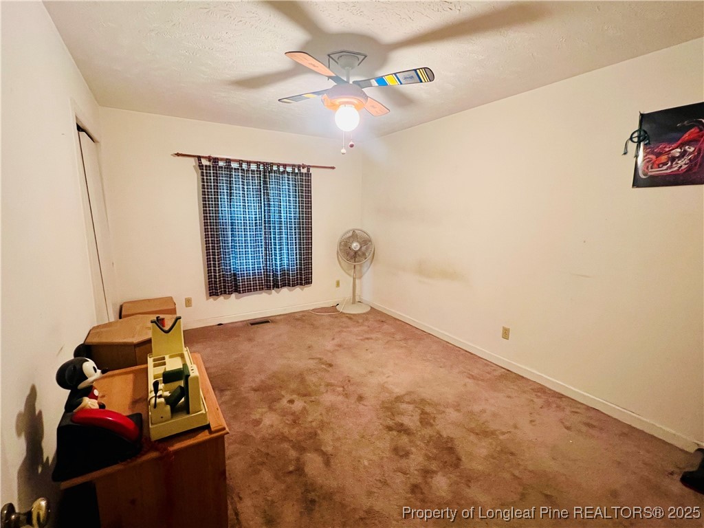 1505 7th Street Lumberton, NC 28358 - Photo 17 of 24 a room with furniture and window