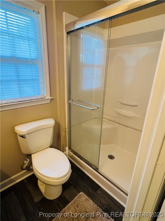 1505 7th Street Lumberton, NC 28358 - Photo 22 of 24 a bathroom with a toilet and a shower
