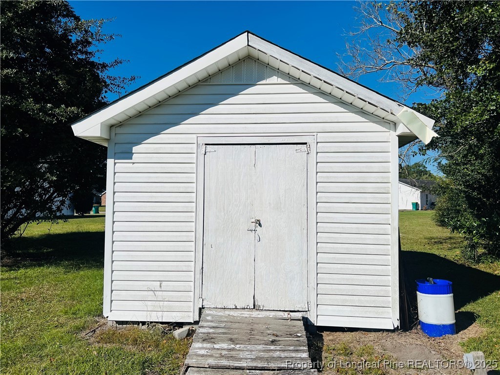 1505 7th Street Lumberton, NC 28358 - Photo 24 of 24 a front view of a house with a yard