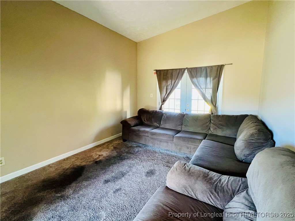 1505 7th Street Lumberton, NC 28358 - Photo 10 of 24 a living room with a couch and a table