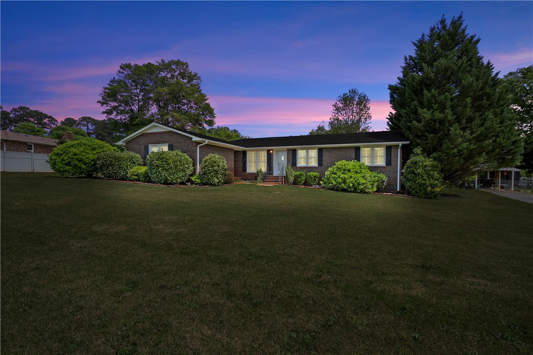 103 Pine Needle Trail Anderson, SC 29625 - Photo 1 of 41 This classic brick residence presents a welcoming facade with a well-maintained lawn and mature landscaping.